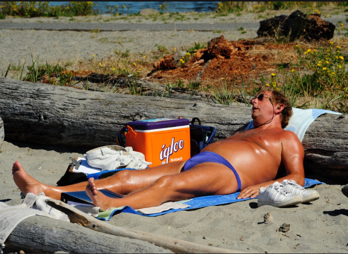 Man sunbathing at the beach