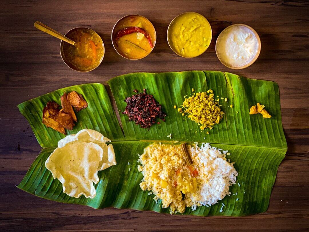 A banana leaf with food on top
