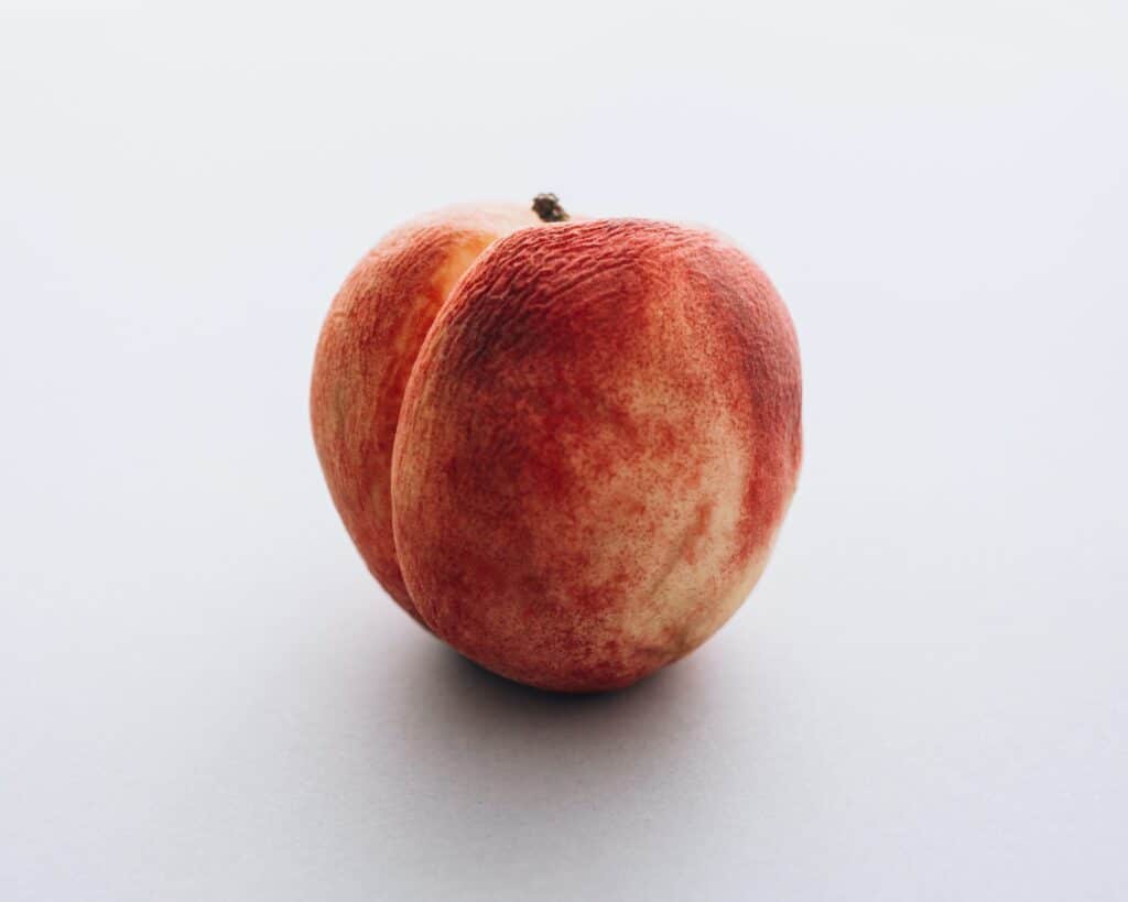 A Peach, symbolizing the bum