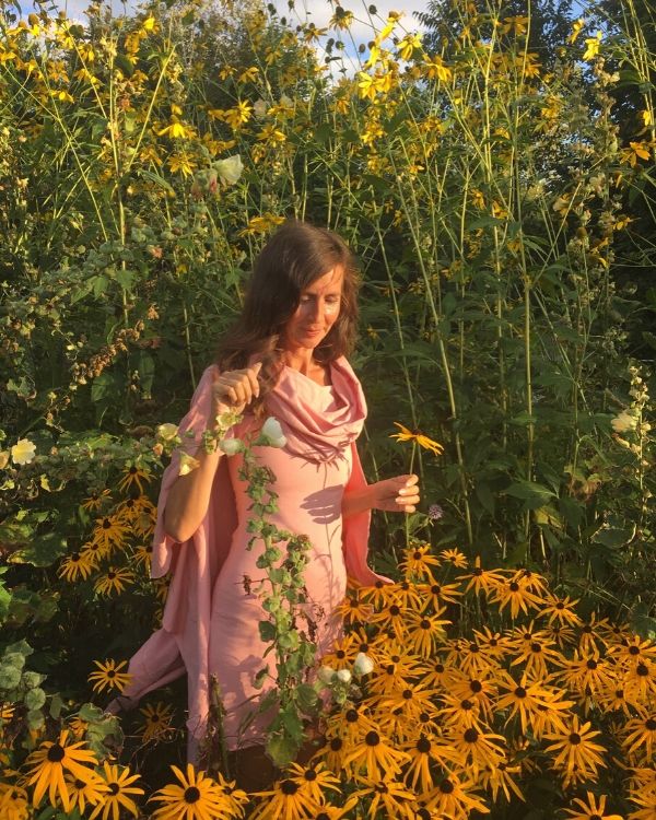 Nadine Artemis in a flower field